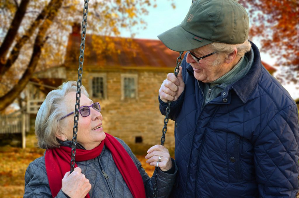 Image of an elderly couple on a swing